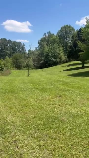Video: pan across a big freshly cut lawn